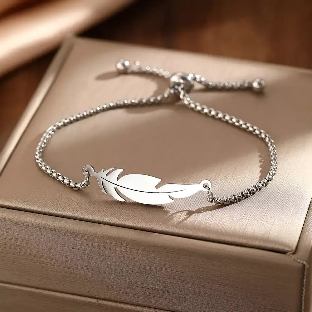 feather bracelete,
women’s bracelet,
stainless steel bracelete,
feather charm bracelete,
gold feather bracelet,
silver feather bracelete,
adjustable women’s bracelet,
minimalist bracelet for women