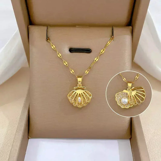 seashell pearl necklace, women’s seashell and pearl necklace, zirconia seashell necklace, elegant seashell necklace, modern pearl necklace, sophisticated women’s necklace, gift necklace for her, elegant beach style seashell necklace, women’s pearl jewellery, delicate seashell pendant necklace, luxury women’s necklace, pearl zirconia necklace gift, stainless steel women’s necklace, birthday gift necklace for women, necklace symbol of protection and love