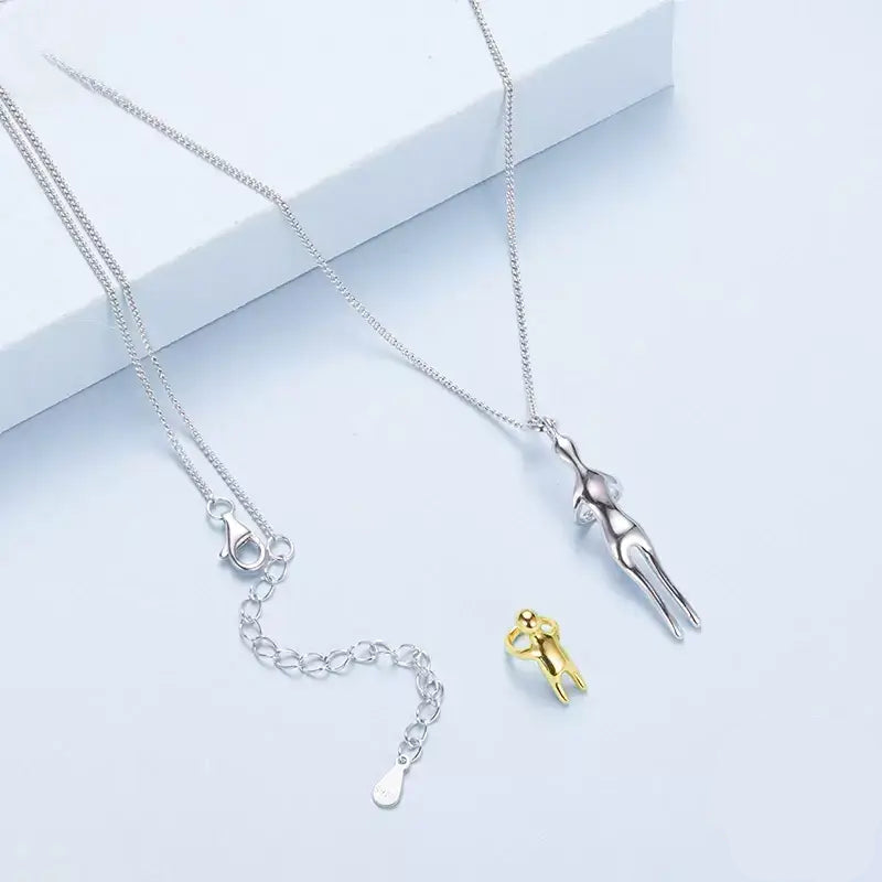 Mother & Child Necklace,

925 Sterling Silver Necklace,

Mother’s Day Gift Necklace,

Sterling Silver Hug Pendant,

Two-tone Silver and Gold Necklace,

Family Bond Necklace,

Sentimental Jewellery for Mum,

Mom and Child Jewellery,

Meaningful Jewellery for Mum,

Keepsake Necklace for Mum