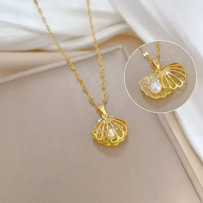 seashell pearl necklace, women’s seashell and pearl necklace, zirconia seashell necklace, elegant seashell necklace, modern pearl necklace, sophisticated women’s necklace, gift necklace for her, elegant beach style seashell necklace, women’s pearl jewellery, delicate seashell pendant necklace, luxury women’s necklace, pearl zirconia necklace gift, stainless steel women’s necklace, birthday gift necklace for women, necklace symbol of protection and love